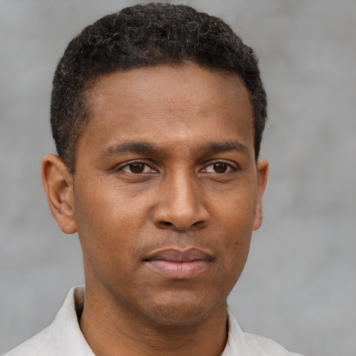 Neutral latino young-adult male with short  brown hair and brown eyes