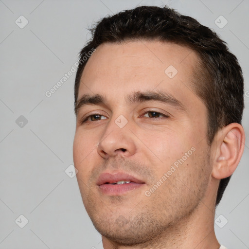 Joyful white young-adult male with short  brown hair and brown eyes