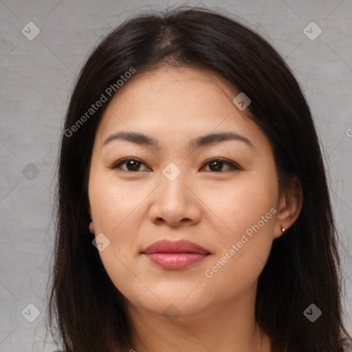 Joyful asian young-adult female with long  brown hair and brown eyes