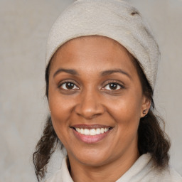 Joyful black young-adult female with medium  brown hair and brown eyes