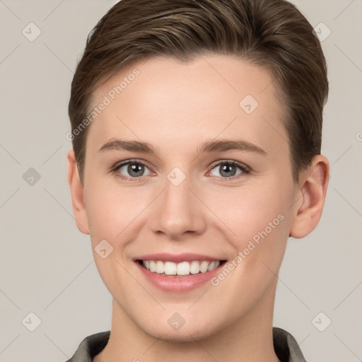 Joyful white young-adult female with short  brown hair and grey eyes