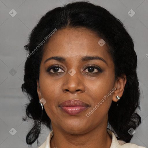 Joyful black adult female with medium  brown hair and brown eyes