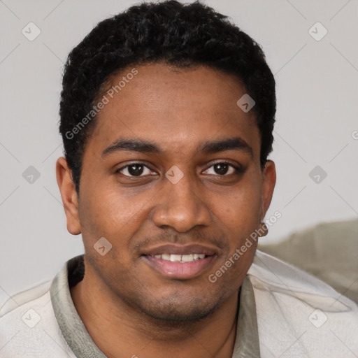 Joyful black young-adult male with short  black hair and brown eyes