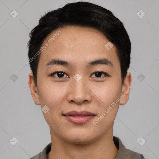 Joyful asian young-adult male with short  black hair and brown eyes