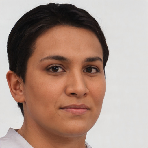 Joyful latino young-adult female with short  brown hair and brown eyes