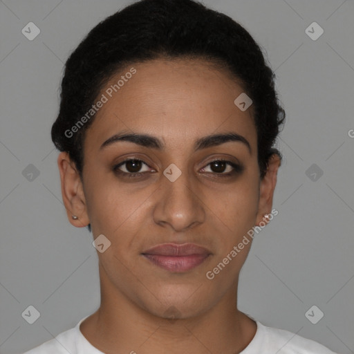 Joyful latino young-adult female with short  brown hair and brown eyes