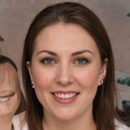 Joyful white young-adult female with medium  brown hair and grey eyes