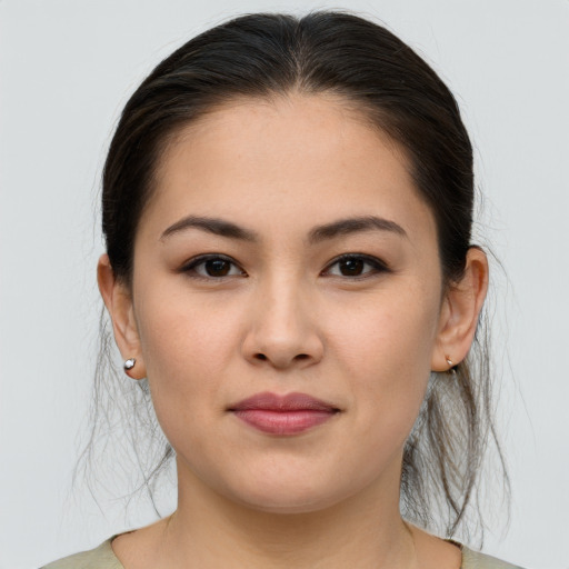 Joyful white young-adult female with medium  brown hair and brown eyes