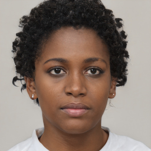 Neutral black young-adult female with short  brown hair and brown eyes