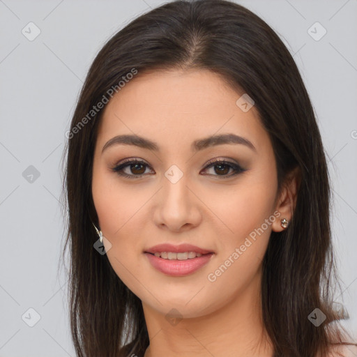 Joyful asian young-adult female with long  brown hair and brown eyes