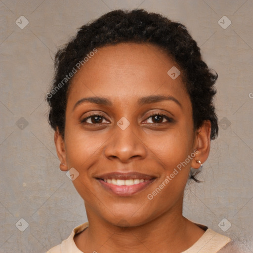 Joyful black young-adult female with short  brown hair and brown eyes