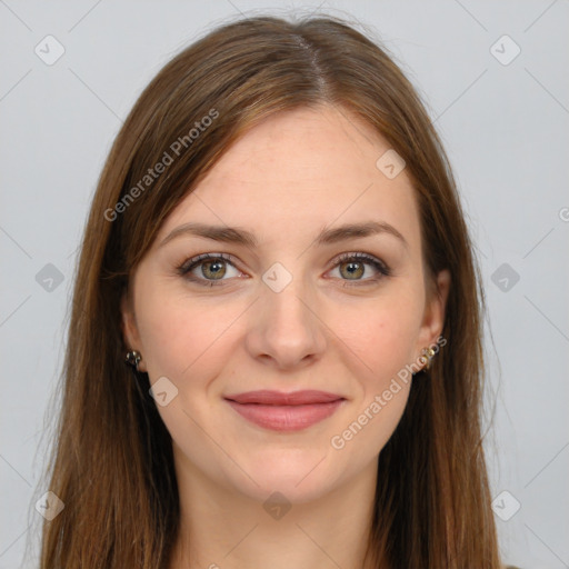 Joyful white young-adult female with long  brown hair and green eyes