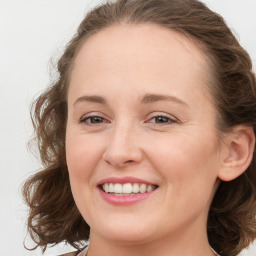 Joyful white young-adult female with medium  brown hair and blue eyes