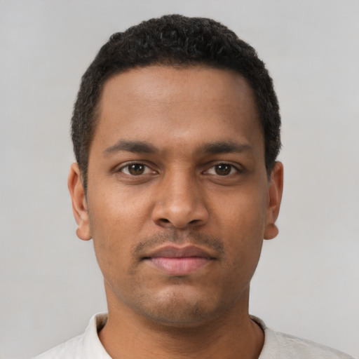 Neutral latino young-adult male with short  brown hair and brown eyes