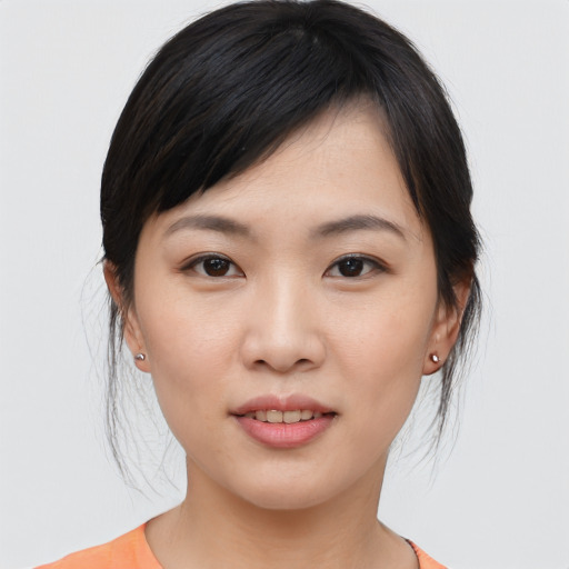 Joyful asian young-adult female with medium  black hair and brown eyes