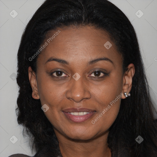 Joyful black young-adult female with long  brown hair and brown eyes