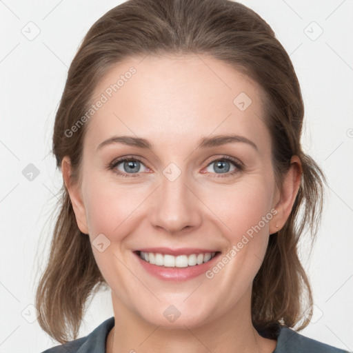 Joyful white young-adult female with medium  brown hair and grey eyes