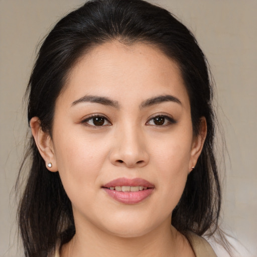 Joyful white young-adult female with medium  brown hair and brown eyes