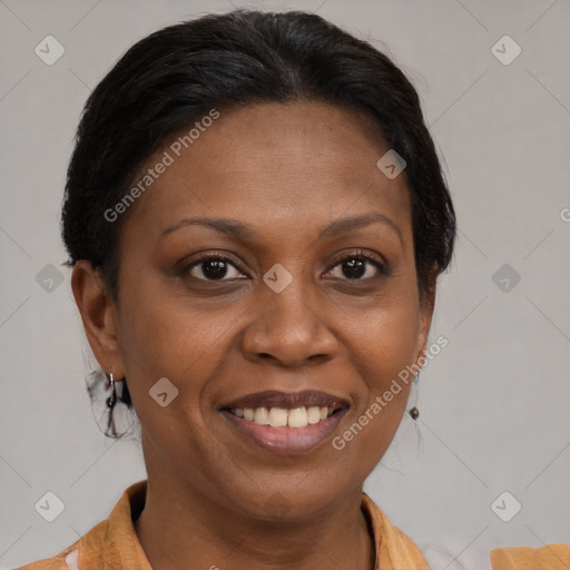 Joyful black adult female with medium  brown hair and brown eyes