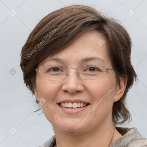 Joyful white adult female with medium  brown hair and grey eyes