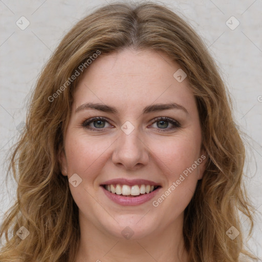 Joyful white young-adult female with long  brown hair and green eyes