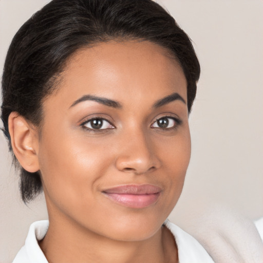 Joyful latino young-adult female with medium  brown hair and brown eyes