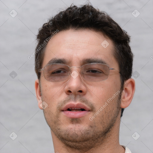 Neutral white young-adult male with short  brown hair and brown eyes