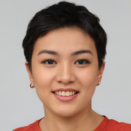 Joyful asian young-adult female with short  black hair and brown eyes