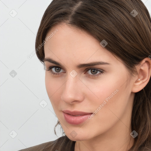 Neutral white young-adult female with long  brown hair and brown eyes