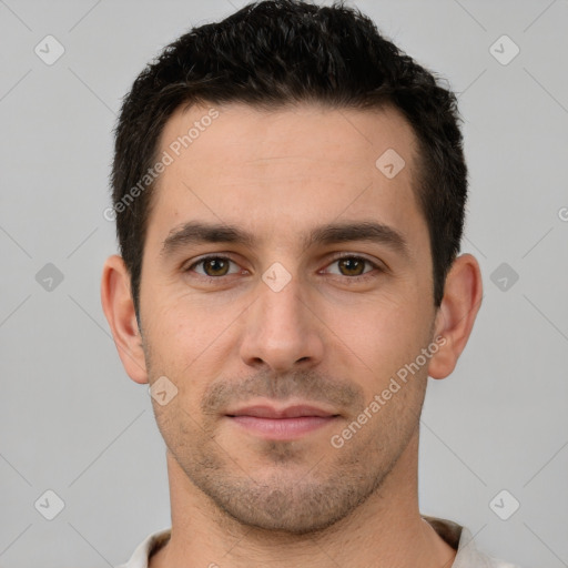 Joyful white young-adult male with short  brown hair and brown eyes