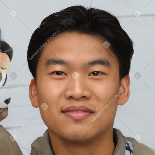 Joyful asian young-adult male with short  black hair and brown eyes