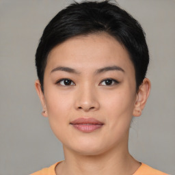 Joyful asian young-adult female with short  black hair and brown eyes