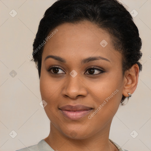 Joyful black young-adult female with short  brown hair and brown eyes