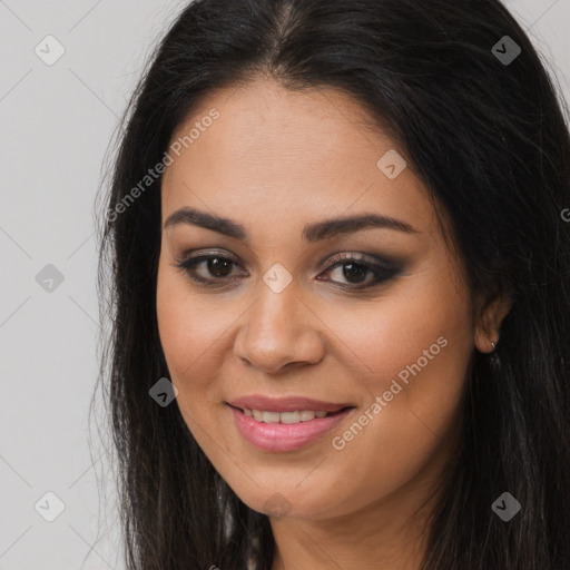 Joyful latino young-adult female with long  brown hair and brown eyes