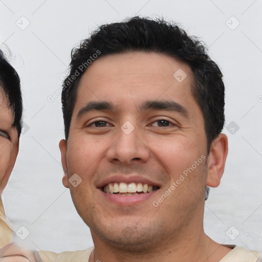 Joyful asian young-adult male with short  black hair and brown eyes