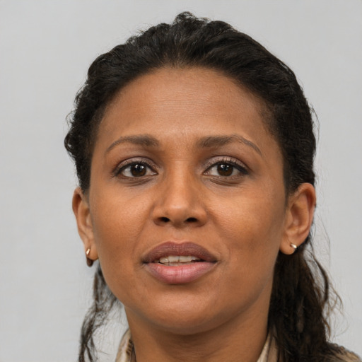 Joyful white adult female with short  brown hair and brown eyes