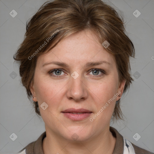 Joyful white adult female with medium  brown hair and blue eyes