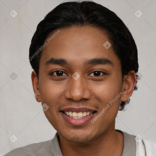 Joyful latino young-adult male with short  black hair and brown eyes