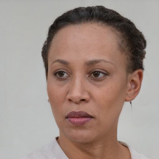 Neutral black adult female with short  brown hair and brown eyes