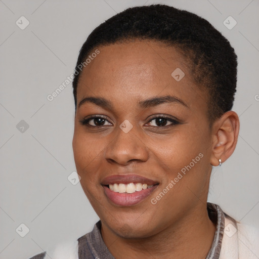 Joyful black young-adult female with short  black hair and brown eyes