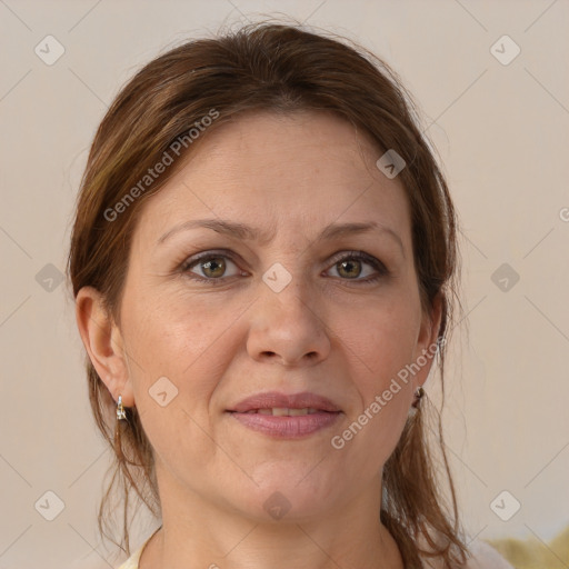 Joyful white adult female with medium  brown hair and grey eyes