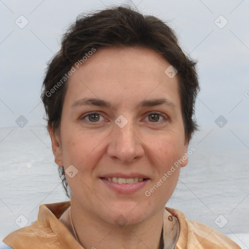 Joyful white adult female with short  brown hair and brown eyes