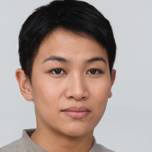 Joyful asian young-adult female with short  brown hair and brown eyes