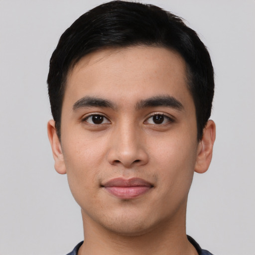 Joyful asian young-adult male with short  black hair and brown eyes