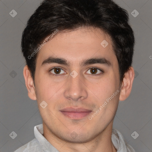 Joyful latino young-adult male with short  brown hair and brown eyes