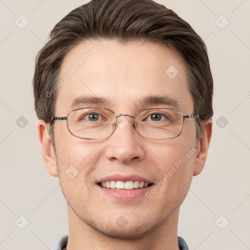 Joyful white adult male with short  brown hair and grey eyes