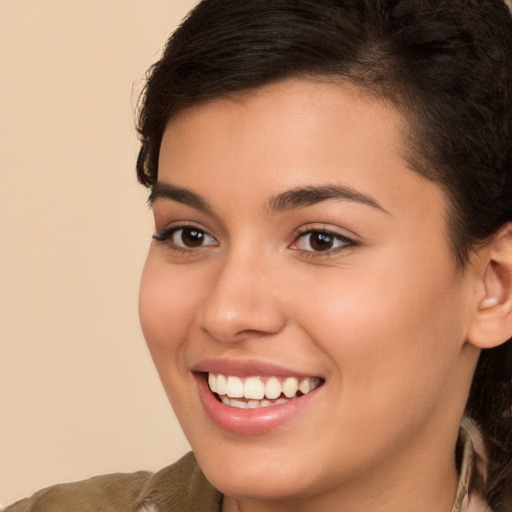 Joyful white young-adult female with long  brown hair and brown eyes