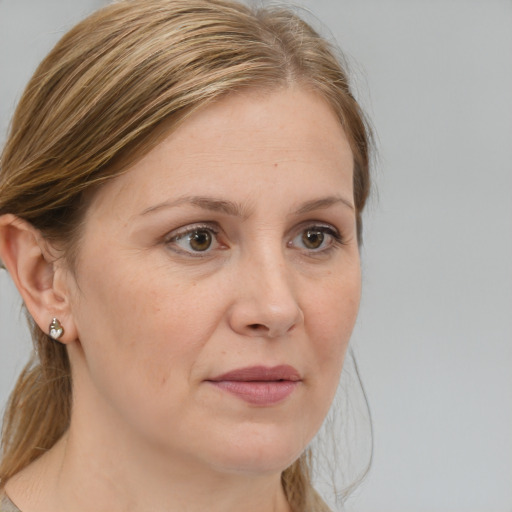 Joyful white adult female with medium  brown hair and grey eyes