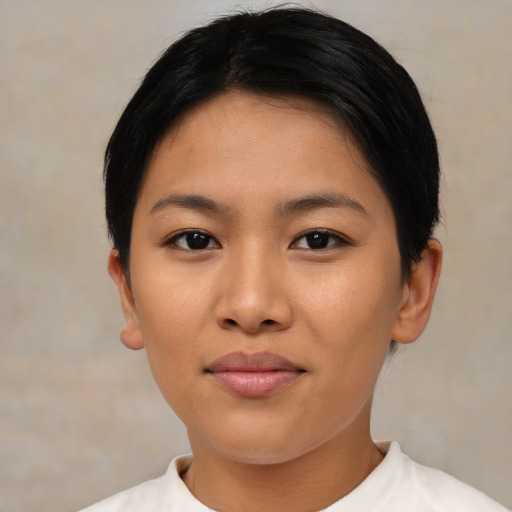 Joyful asian young-adult female with short  brown hair and brown eyes