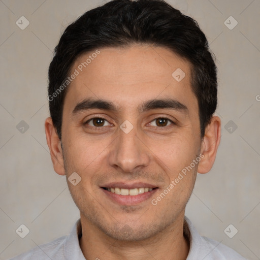 Joyful white young-adult male with short  black hair and brown eyes